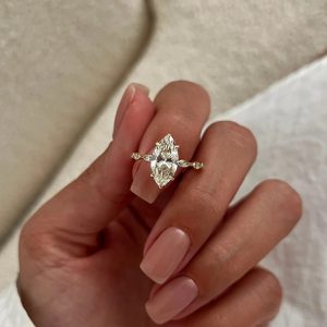 Marquise diamond engagement ring with marquise-accented decorative band