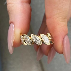 Band with five bezel-set marquise diamonds on a polished band