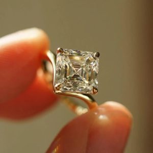 Asscher cut solitaire engagement ring in a four-prong open gallery setting