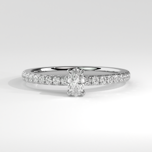 Oval engagement ring with pavé band and four-prong basket setting
