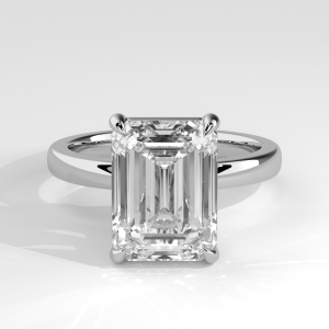 Emerald-cut solitaire engagement ring with four-prong setting and plain band